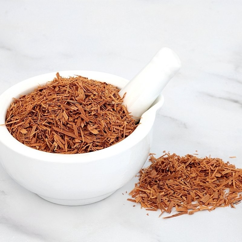 cat's claw root in a mortar and on the table cat's claw root in a mortar and on the table