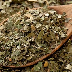 mulberry leaves in a wooden spoon