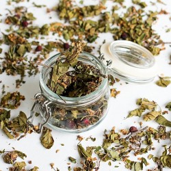 Hawthorn leaves in a glass jar and on the table