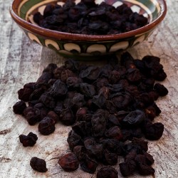 schisandra berries in a bowl and on the table