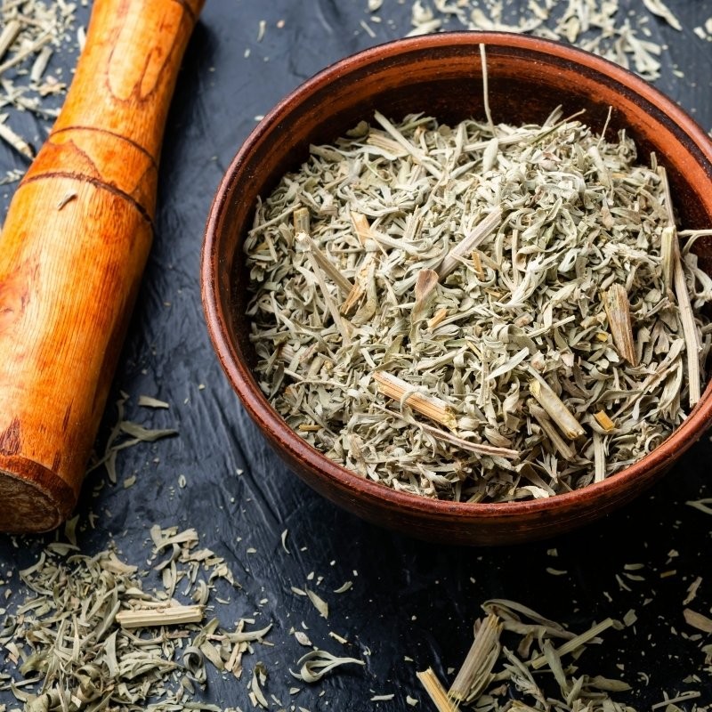 dry wormwood in a mortar dry wormwood in a mortar
