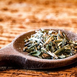 dry hyssop in a wooden spoon