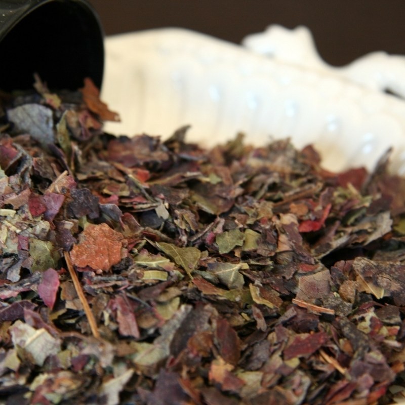 dried red vine leaves in a glass and on a plate