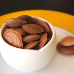 sucupira seeds in a bowl and on a plate